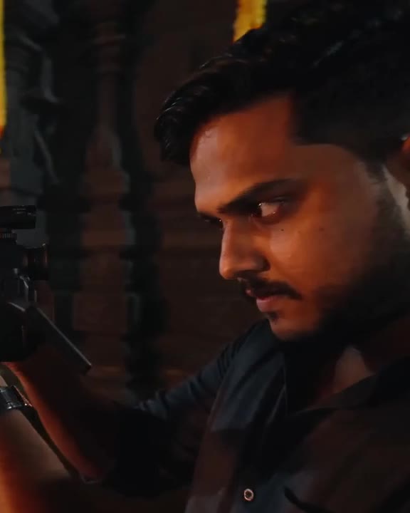 Kiran filming with a cinema camera